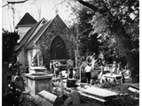 Tidying the churchyard c 1980