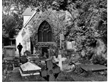 Tidying the churchyard c 1980